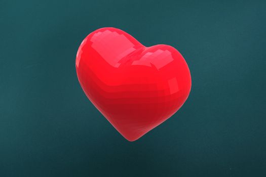 Red heart against teal