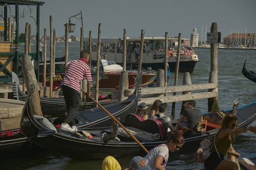 VENICE, ITALY 25 MARCH 2019: Gondola in Venice with people on board