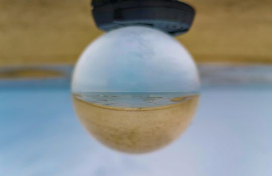 Baltic sea at beach in Swinoujscie in reflection in crystal ball