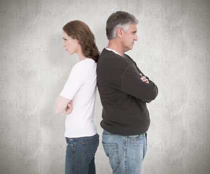Casual couple not speaking after fight against white background