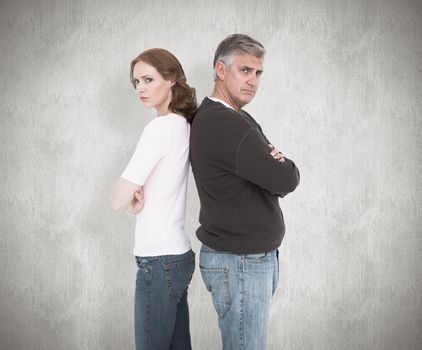 Casual couple not speaking after fight against white background