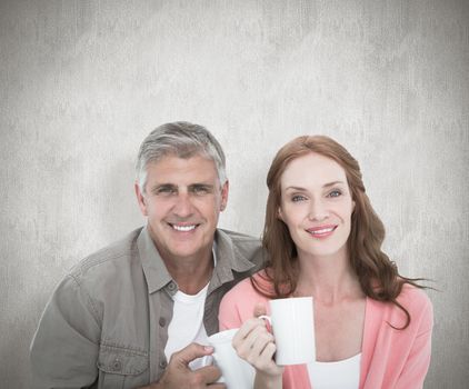 Casual couple having coffee together against white background