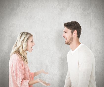 Attractive couple talking about something shocking against white background