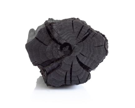 Natural black charcoal isolated on white background
