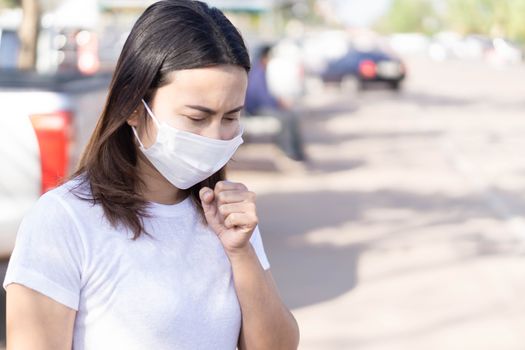 Closeup woman wearing face mask for protect air polution or virus covid 19, health care and medical concept