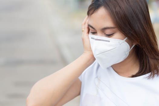 Closeup woman wearing face mask for protect air polution, health care and medical concept