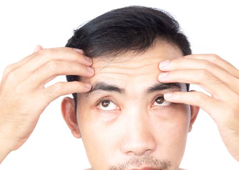 Closeup man showing wrinkles on forehead