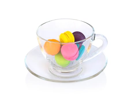 Colorful magaroons in glass isolated on white background, sweet and dessert concept