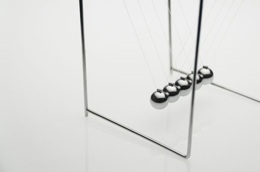 balancing balls on a white background, isolated. business concept. Newtons Cradle