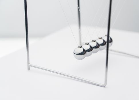 balancing balls on a white background. business concept. Newtons Cradle