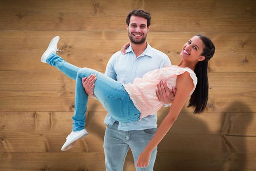 Attractive young couple having fun against bleached wooden planks background