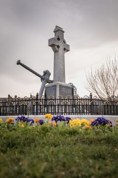 Howth near Dublin, Ireland - February 15, 2019: view of the monument was erected by the Howth fishermans association and commemorates the lives of all persons lost at sea in the city center on a winter day