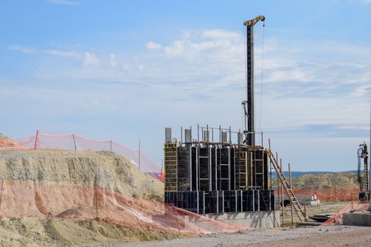 Construction of a new road and transport interchange. Work on reinforced concrete structures and road surface.