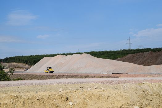 Construction of a new road and transport interchange. Work on reinforced concrete structures and road surface.