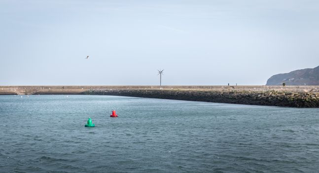 Howth near Dublin, Ireland - February 15, 2019: view of the fishing port of the city where are parked professional fishing boats on a winter day