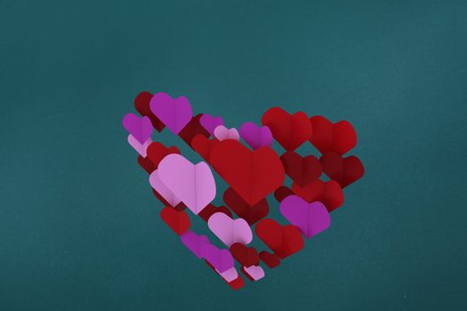 Love hearts against teal