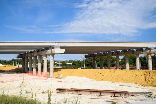 Construction of a new road and transport interchange. Work on reinforced concrete structures and road surface.