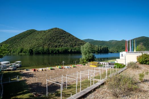 piediluco lake with view of the island in the middle of the lake and beach front with sand