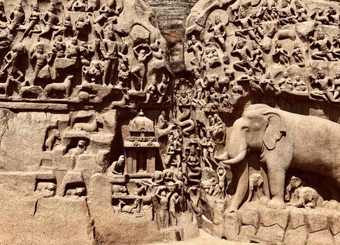Descent of the Ganges is one of the Group of Monuments at Mahabalipuram and it is a UNESCO World Heritage Site. It is a giant open-air rock cut bas relief sculptures carved on two monolithic rocks. The story depicted in the relief is the descent of the sacred river Ganges to earth from the heavens. The relief was created by Narasimhavarman-1 to celebrate the victory over Chalukiya king. There are 146 sculptures of animals, God, people and half-humans carved in the rock relief.