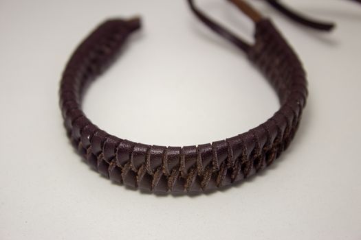 Leather bracelet, braided in a beautiful pattern, with straps to fasten on the wrist
