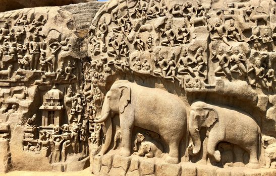 Descent of the Ganges is one of the Group of Monuments at Mahabalipuram and it is a UNESCO World Heritage Site. It is a giant open-air rock cut bas relief sculptures carved on two monolithic rocks. The story depicted in the relief is the descent of the sacred river Ganges to earth from the heavens. The relief was created by Narasimhavarman-1 to celebrate the victory over Chalukiya king. There are 146 sculptures of animals, God, people and half-humans carved in the rock relief.
