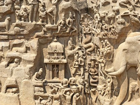 Descent of the Ganges is one of the Group of Monuments at Mahabalipuram and it is a UNESCO World Heritage Site. It is a giant open-air rock cut bas relief sculptures carved on two monolithic rocks. The story depicted in the relief is the descent of the sacred river Ganges to earth from the heavens. The relief was created by Narasimhavarman-1 to celebrate the victory over Chalukiya king. There are 146 sculptures of animals, God, people and half-humans carved in the rock relief.