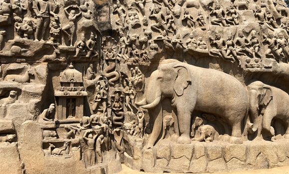 Descent of the Ganges is one of the Group of Monuments at Mahabalipuram and it is a UNESCO World Heritage Site. It is a giant open-air rock cut bas relief sculptures carved on two monolithic rocks. The story depicted in the relief is the descent of the sacred river Ganges to earth from the heavens. The relief was created by Narasimhavarman-1 to celebrate the victory over Chalukiya king. There are 146 sculptures of animals, God, people and half-humans carved in the rock relief.