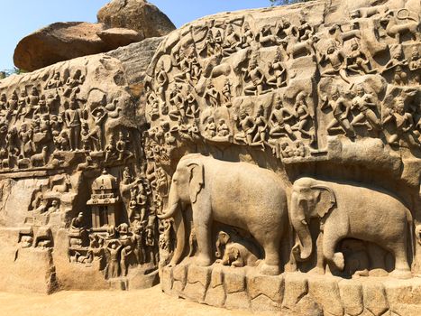 Descent of the Ganges is one of the Group of Monuments at Mahabalipuram and it is a UNESCO World Heritage Site. It is a giant open-air rock cut bas relief sculptures carved on two monolithic rocks. The story depicted in the relief is the descent of the sacred river Ganges to earth from the heavens. The relief was created by Narasimhavarman-1 to celebrate the victory over Chalukiya king. There are 146 sculptures of animals, God, people and half-humans carved in the rock relief.