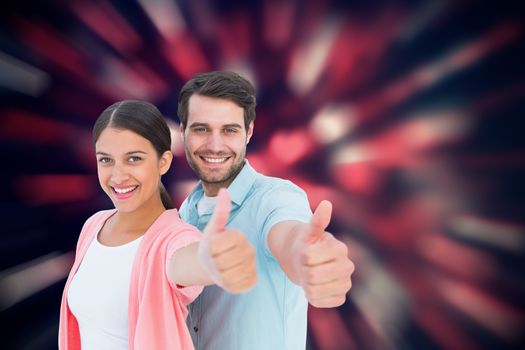 Happy couple showing thumbs up against valentines heart pattern