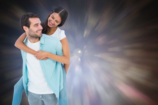 Happy casual man giving pretty girlfriend piggy back against dark abstract light spot design