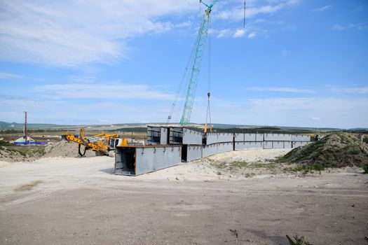 Steel parts of the bridge structure. Construction of a road junction.