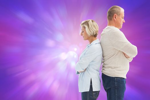 Unhappy couple not speaking to each other  against purple abstract light spot design