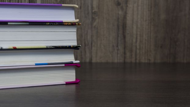 Stack of colorful books for study on wooden table, education, student, student, College, University