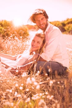 Attractive couple relaxing in the countryside on a sunny day