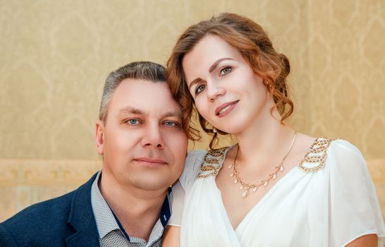 portrait of couple of lovers posing in the hall of prefecture at marriage