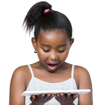 Close up portrait of cute little african girl with ponytail looking down at digital tablet.Kid with surprised facial expression Isolated on white background.
