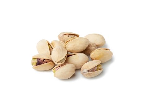 bunch of salted open inshell pistachios isolated on a white background, tasty and healthy snack