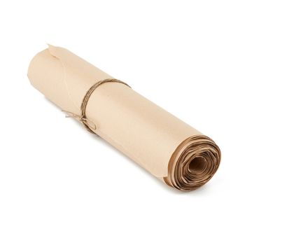 twisted roll of brown paper isolated on a white background, wax paper for baking