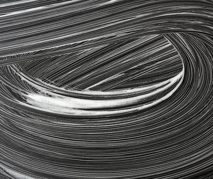 white soap foam on a black background, top view, concept of cleanliness, antibacterial