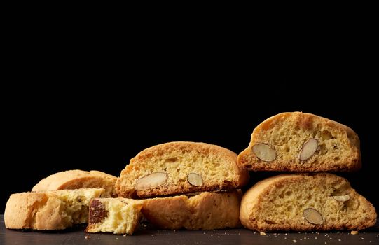 baked piece Italian almond biscotti, cantuccini cookies, traditional italian Christmas, New Year dry cookies. baking isolated on white background