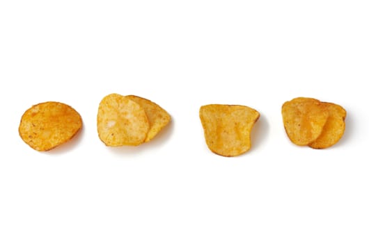 various potato chips with spice isolated on a white background, top view