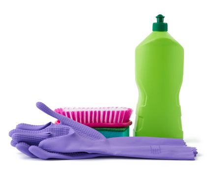 washing sponges, rubber protective gloves, brushes and cleaning agent in a green plastic bottle, set isolated on a white background