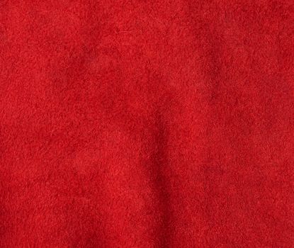 texture of red suede with large fibers, bright scarlet color, template for the designer