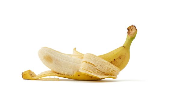 peeled ripe yellow banana isolated on a white background, close up