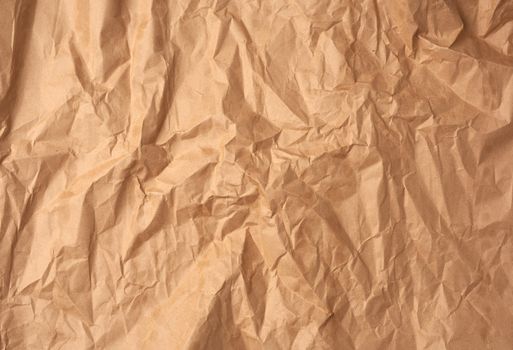 crumpled blank sheet of brown wrapping kraft paper, vintage texture for the designer, full frame