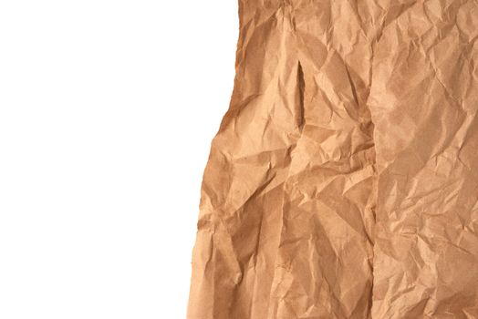 piece of crumpled brown paper isolated on white background, element for designer
