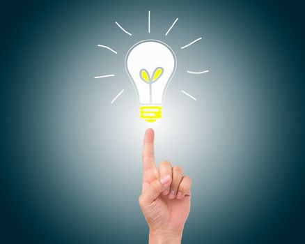 Bulb light on fingertip on blue background - Idea Conceptual