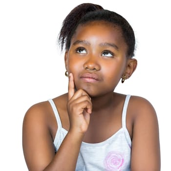 Close up portrait of cute little african girl with wondering facial expression.Kid with finger on cheek looking up at corner.Isolated on white background.