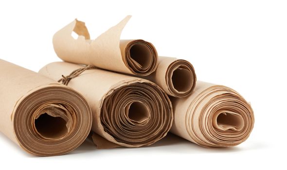 stack of twisted rolls of brown paper isolated on white background, close up