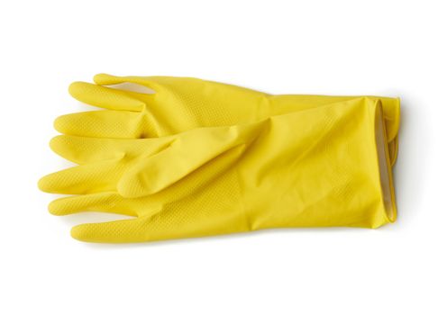 yellow rubber gloves for cleaning washing dishes isolated on white background, close up